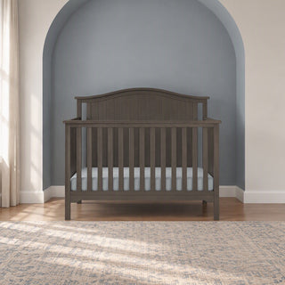 Child Craft Hampton Arch Top 4-in-1 Convertible Crib in Dusty Heather, a sturdy pine wood crib with an arched headboard and adjustable mattress support.