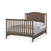 The Child Craft Hampton Arch Top 4-in-1 Convertible Crib in Dapper Grey features a slatted headboard and footboard, adjustable mattress support, and is shown with white bedding and a gray blanket.