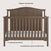 The Child Craft Hampton Arch Top 4-in-1 Convertible Crib in Dusty Heather features an elegant arched top, vertical slats, a white mattress, 3 mattress positions, and durable pine wood construction.