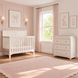 Child Craft Woodland 4-in-1 Convertible Crib in Brushed Cotton and a matching dresser in a nursery with pink walls, pink curtains, and a pink scalloped rug.