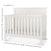 The Child Craft Woodland 4-in-1 Convertible Crib in Brushed Cotton is a white wooden crib with slatted sides, a paneled headboard, and dimensions of 47