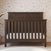 Child Craft Woodland 4-in-1 Convertible Crib in Brushed Truffle with a paneled headboard featuring a decorative X-brace design and adjustable mattress support.