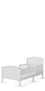 The Child Craft Hampton Toddler Bed in Matte White features a paneled headboard and footboard, sturdy guard rails for safety, and a low-to-the-ground design for easy access, shown on a plain white background.