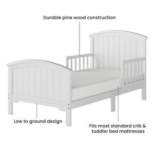 The Child Craft Hampton Toddler Bed in Matte White features a slatted headboard and footboard, sturdy pine wood, built-in guard rails, a low profile design, and fits most standard crib or toddler mattresses.