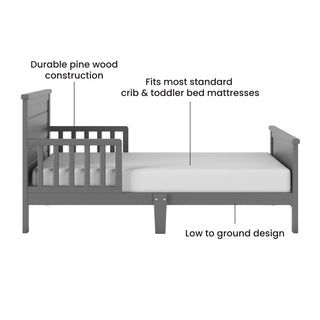 The Child Craft Woodland Toddler Bed in Brushed Pebble features rails, headboard, footboard, durable pine wood, a low-to-the-ground design, and fits standard crib and toddler bed mattresses.