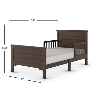 The Child Craft Woodland Toddler Bed in Brushed Truffle features a dark brown finish, headboard, footboard, side rails, and mattress. Dimensions: 55"L x 30"W x 27.25"H.