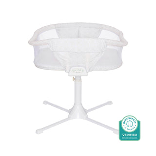 The HALO BassiNest® Twin Sleeper is a white baby bassinet with mesh sides and a sturdy four-legged base, ideal for twins or single use. Features the “Baby Safety Alliance Verified” badge in the bottom right corner.