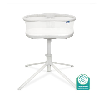 The HALO BassiNest Swivel Sleeper 3.0 is a white bedside bassinet with mesh sides on a raised stand with four splayed legs, ensuring safe baby sleep. A Baby Safety Alliance Verified badge appears in the bottom right corner.