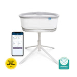 The HALO BassiNest® Connected Swivel Sleeper 3.0, a white and gray smart bassinet on a tripod base, is shown next to a smartphone with the soothing center app featuring AutoSoothe technology. Awarded Best for Baby 2023 and Baby Safety Verified badges.