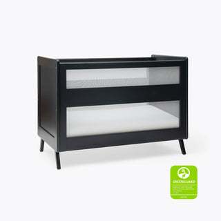 The HALO 3-in-1 Convertible Full Size Breathable Mesh Crib features modern black mesh, a white mattress, and a GREENGUARD Gold Certification badge, ensuring low chemical emissions for your baby's safety.