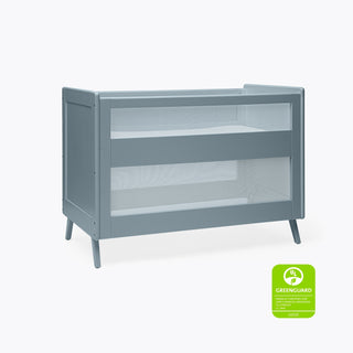 The HALO 3-in-1 Convertible Full Size Breathable Mesh Crib in modern gray with angled legs is pictured on a plain white background, featuring a GREENGUARD Gold Certified badge in the lower right corner.