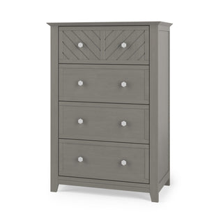 The Child Craft Atwood 4-Drawer Chest in Lunar Gray features a chevron-patterned top drawer and plain lower drawers, each with two round silver knobs—an ideal, stylish storage solution for a baby nursery.