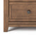 Close-up of the Child Craft Atwood 4-Drawer Chest in Cocoa Bean, showing a drawer with a hexagonal knob and sturdy angled leg—ideal for use as a baby dresser or modern nursery chest.
