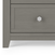 Close-up of a gray wooden drawer with a hexagonal silver knob, part of the Child Craft Atwood 3-Drawer Dresser in Lunar Gray. Its clean lines and modern style make it ideal for nurseries or pairing with a baby changing table topper.