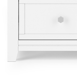 A close-up of the Child Craft Atwood 3-Drawer Dresser in Matte White, featuring hexagonal silver knobs and a clean, minimalistic design—ideal for use in a baby nursery or paired with a changing table topper.
