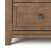 Close-up of the Child Craft Atwood 3-Drawer Dresser in Cocoa Bean, showing a wooden drawer with a hexagonal dark knob, sleek brown finish, and modern look. Part of the full dresser, set against a white background.