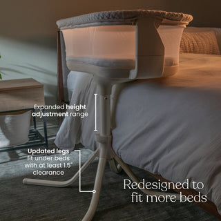 A white HALO BassiNest® Swivel Sleeper 4.0 Air with Dreamweave Breathable Pad and mesh sides is next to a bed. Text highlights expanded height adjustment and updated legs that fit under beds with at least 1.5" clearance.