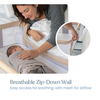 A woman lies on a bed next to her baby sleeping in a HALO 2-in-1 Bedside Bassinet Sleeper with a zip-down mesh side. An inset shows a hand unzipping the wall. Text: Breathable Zip-Down Wall for soothing access and airflow.