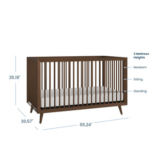 The Child Craft Cranbrook 3 Piece Nursery Set features a mid-century modern wooden crib with vertical slats (35.19"H x 30.57"D x 55.24"W) and three adjustable mattress heights: newborn, sitting, and standing. Includes crib, dresser, and chest.