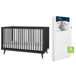 The Child Craft Cranbrook 2-Piece Crib and DreamWeave Set in Ebony includes a black wooden crib with baby-safe finishes and a white breathable mattress; nearby is another DreamWeave mattress with baby photo packaging and a green GREENGUARD label.