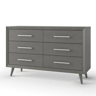 The Child Craft Cranbrook Double Dresser in Lunar Gray features six drawers, sleek metal handles, and angled legs, making it a stylish nursery furniture piece. Shown against a plain white background.