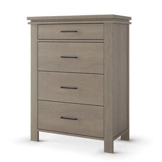 The Child Craft Denman 4 Drawer Chest in Crescent Gray features a tiered top edge, black bar handles, and square legs—stylish nursery furniture perfect for any space.