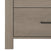 Close-up of the Child Craft Denman 4 Drawer Chest in Crescent Gray with a modern black handle, two visible drawers, and part of the left leg. The wood grain highlights the natural, stylish look of this nursery furniture piece.