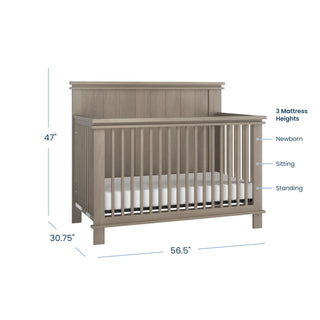 The Child Craft Denman 2-Piece Crib and DreamWeave Set in Crescent Grey features a gray wooden convertible crib with baby-safe finishes, vertical slats, three mattress heights—Newborn, Sitting, Standing—and measures 47"x56.5"x30.75".