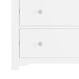 The Child Craft Harmony 3-Drawer Dresser with Changing Table Topper in matte white features clean lines, round silver knobs, and a minimalist design—ideal nursery furniture for a modern touch.