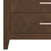 Close-up of the left side of the Child Craft Kieran 5-Drawer Chest in Toasted Chestnut with two visible drawers, each featuring a sleek rectangular metallic handle—an elegant addition to any nursery.