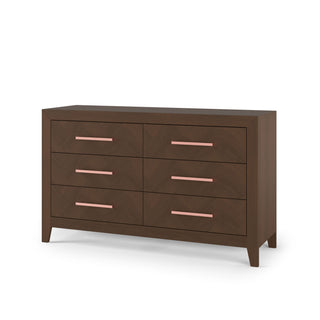 The Child Craft Kieran 6-Drawer Double Dresser in Toasted Chestnut features a modern design with sleek pink handles, short tapered legs, and a subtle herringbone pattern for contemporary style.