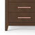Close-up of the Child Craft Kieran 6-Drawer Double Dresser in Toasted Chestnut with a herringbone pattern, showing two drawers and long horizontal light pink handles. Only the lower part is visible against a white background.
