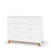 The Child Craft Soho 3-Drawer Dresser in White/Natural features three spacious drawers and natural wood angled legs in a mid-century modern style—perfect as stylish nursery furniture.