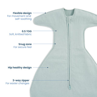 The HALO SwaddleStretch™ Newborn Swaddle TOG 0.5 in light blue has stretchy sleeves, a hip-healthy design, soft knitted fabric, snug fit for flexible movement, and a 2-way zipper for easy diaper changes.