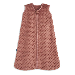 The HALO Wearable Blanket Plushy Dot Velboa TOG 1.5 is a sleeveless, rose-colored baby sleep sack made from soft, textured fabric with raised dots and a front zipper, designed for safe and cozy sleep.