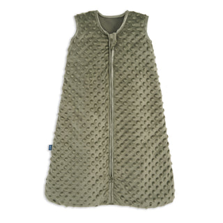 The HALO Wearable Blanket Plushy Dot Velboa TOG 1.5 in olive green features a textured, dimpled fabric, sleeveless design, front zipper from neck to bottom, and a small left-side tag for safe baby sleep.