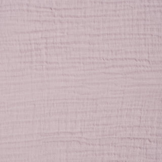 Close-up of HALO Fitted Crib Sheets 100% Organic Cotton Muslin 2 Pack in light pink, showing breathable, soft gauzy fabric with a subtle grid pattern formed by horizontal and vertical lines.