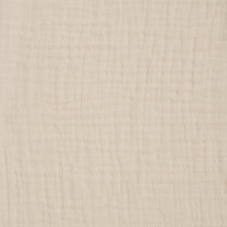 A close-up of HALO Fitted Crib Sheets 100% Organic Cotton Muslin 2 Pack shows light beige, slightly textured fabric with a subtle grid pattern. The soft, woven surface is perfect for breathable crib sheets.
