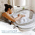 A woman lying in bed gently touches a sleeping baby in a HALO BassiNest® Luxe Swivel Sleeper Bassinet with an easy-lowering wall. Text on the image reads, 
