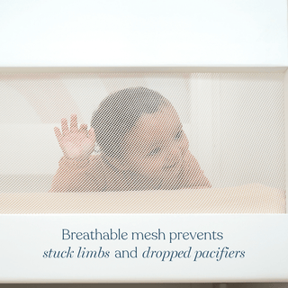 A baby looks through a white mesh crib side. Text reads: The HALO 3-in-1 Convertible Full Size Breathable Mesh Crib helps prevent stuck limbs and dropped pacifiers.