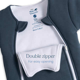 A blue Baby Merlin's Magic Sleepsuit® 100% Cotton by HALO, size small, features white lining and double zippers with an inner flap reading “Double zipper For easy opening”—ideal for infants transitioning out of swaddles.