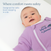 A baby in a lavender Baby Merlin's Magic Sleepsuit® 100% Cotton by HALO lies on their back in a crib. Text: Where comfort meets safety. The ideal swaddle transition for better sleep and safe back sleeping in the crib.