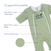 HALO’s Baby Merlin's Magic Sleepsuit® 100% Cotton is shown in green with two zippers. Labels highlight its three layers: soft cotton outer, cozy cotton lining, and plush polyfill core—ideal comfort for swaddle transition.