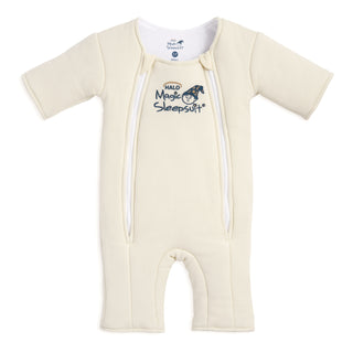 The HALO Baby Merlin's Magic Sleepsuit® 100% Cotton is a cream baby sleep suit with long sleeves and legs, dual front zippers, and a sleeping moon logo—ideal for swaddle transition.