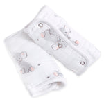 The aden + anais essentials cotton muslin strap covers 2 pack features two soft, quilted white cloth pads with playful gray elephant designs, secured by metal snaps. Ideal for infant or child care.
