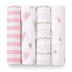 Four aden + anais boutique 100% cotton muslin swaddle blankets are displayed upright with breathable patterns: pink/white stripes, hearts/dots, wavy lines, and scattered dots in pink, grey, and beige hues. These swaddles ensure absorbency and comfort on a clean white background.