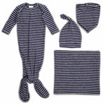 The aden + anais snuggle knit™ newborn gift set includes a footed sleep gown with knotted bottom, a knotted baby hat beanie, a snap closure bib, and a square swaddle blanket—all featuring matching navy blue and white horizontal stripes.