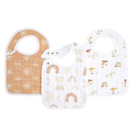 Aden + Anaiss boutique 100% cotton muslin snap bibs 3 pack includes: a brown bib with white patterns, a middle one with brown/gray rainbows, and a right one featuring trees, rainbows, and animals. These absorbent muslin bibs offer an adjustable fit for comfort.
