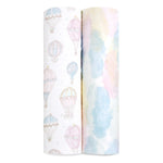 The aden + anais organic cotton muslin swaddle blanket 2 pack includes GOTS certified fabric rolls: one with pastel hot air balloons on white, and another with a watercolor design in blended pastels, ideal for eco-friendly crafting.