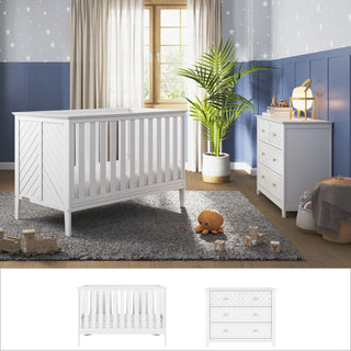 A bright nursery with the Child Craft Atwood 3-in-1 Euro 2-Piece Nursery Set, a gray rug, wooden toys on the floor, a plush bear, a potted plant, star-patterned wallpaper, and sheer curtains letting in sunlight.